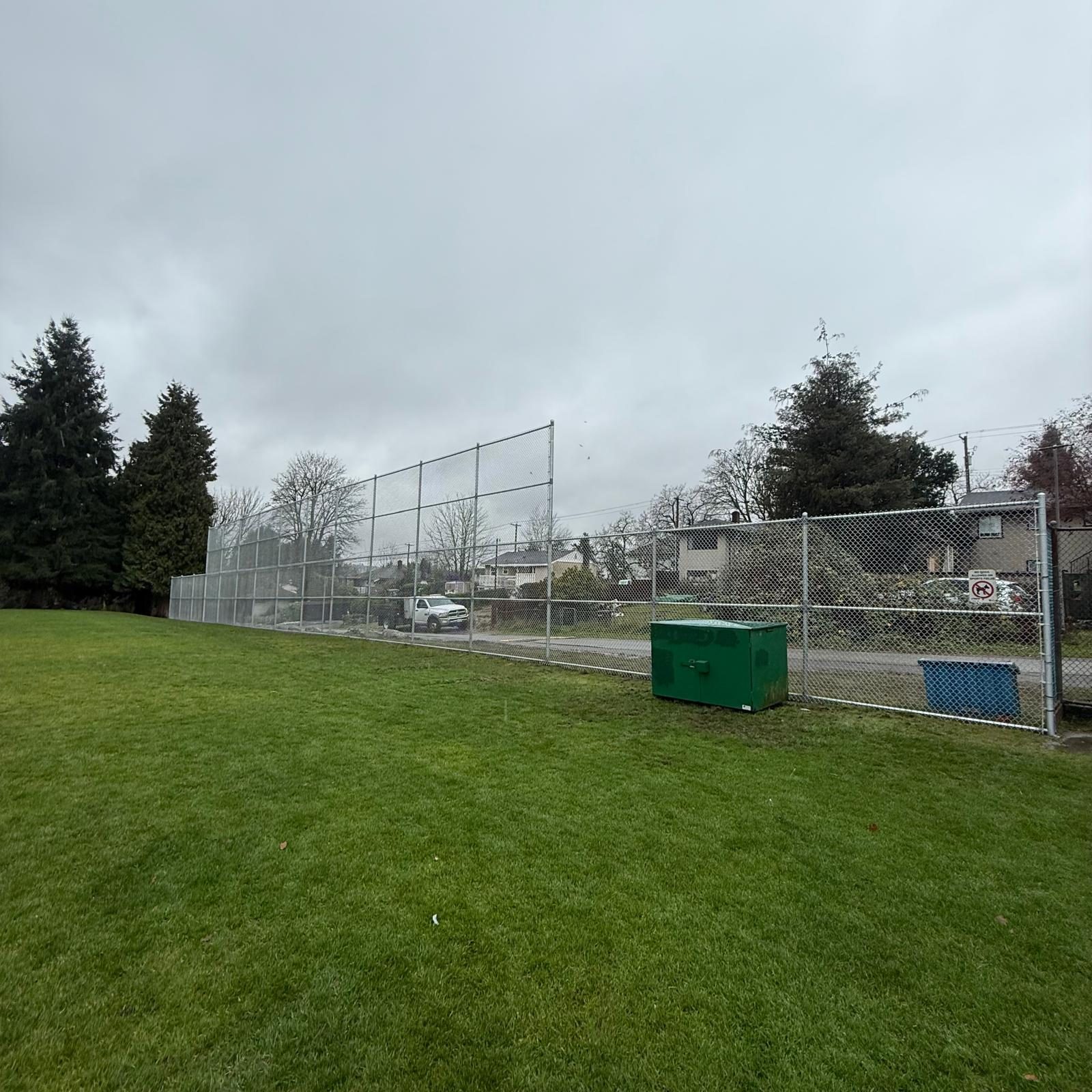 Tall chain link backstop at a ball field