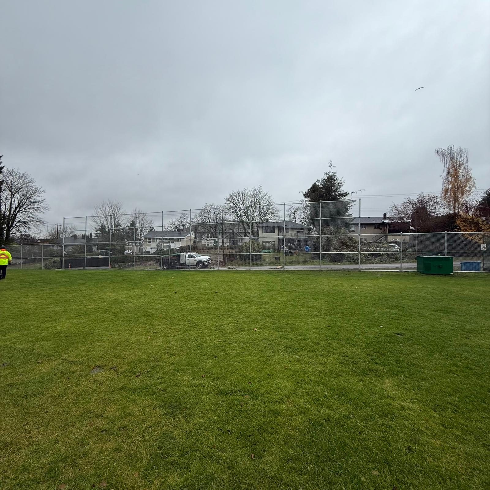 Chain link fence around a park field