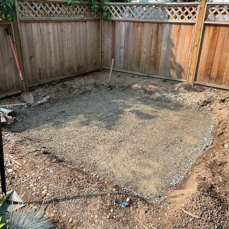 Dug-out backyard area with a levelled gravel base
