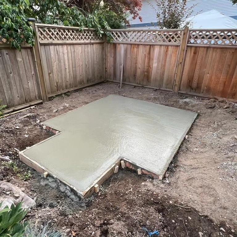 Poured concrete pad inside wood forms